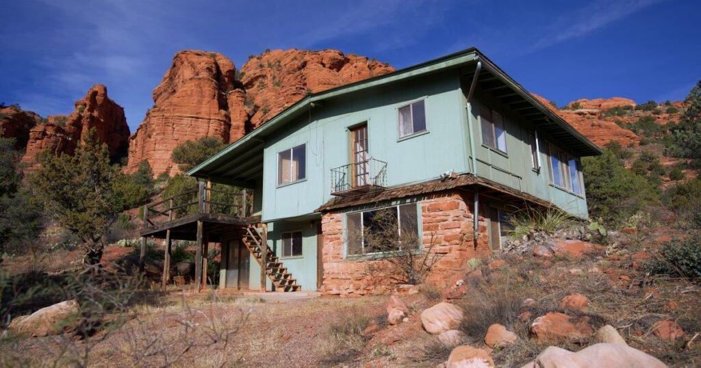 Foreclosure help El Paso TX – desert home with rocky hills behind it under a blue sky