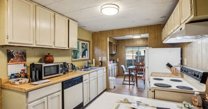 Costs to sell older house Texas – dated kitchen with older cabinets and appliances