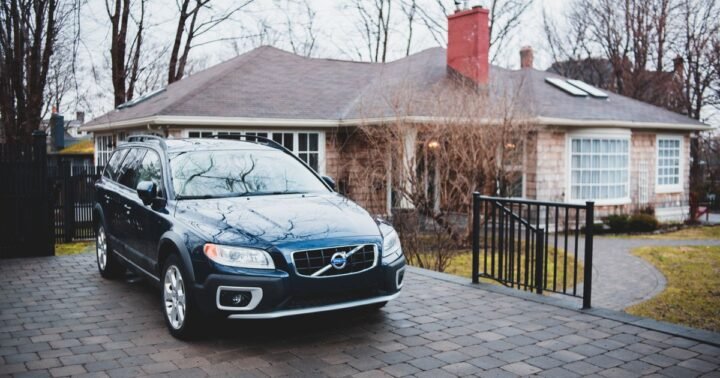 Unwanted inherited rental property Texas – single-story brick rental house with a car in the driveway