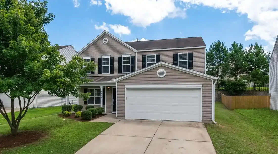 Cash home buyers Plano TX – two-story home with a two-car garage