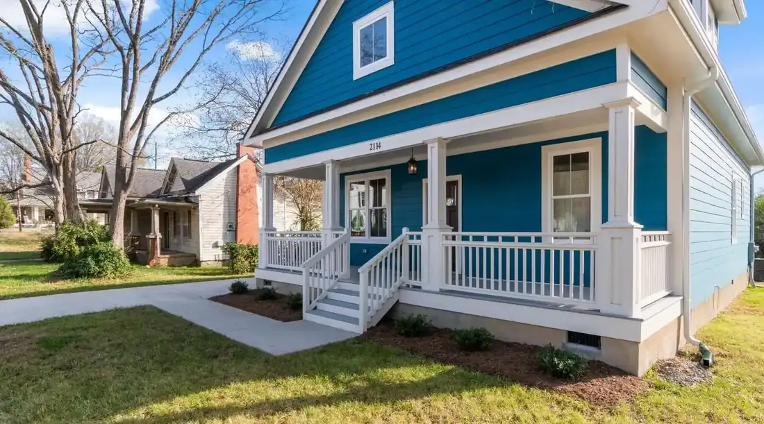 Sell inherited property Texas – blue house with a white front porch