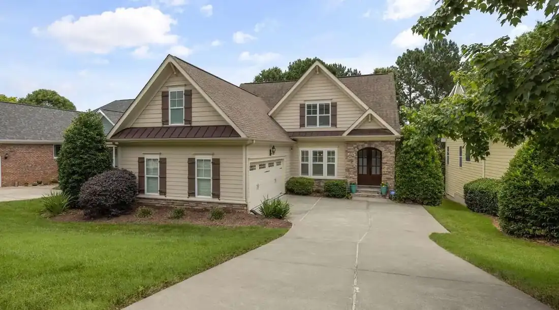 Sell house with liens Texas – brick-accented suburban home with a driveway